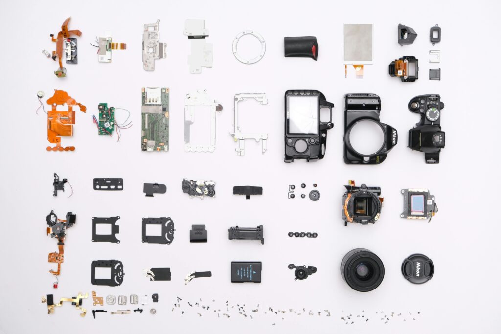 A detailed flat lay of disassembled camera components showcasing intricate electronics.